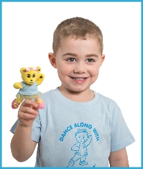Young boy dancer with a Melody Bear finger puppet