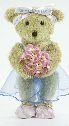 Photo of ballet teddy, Melody Bear, holding primroses