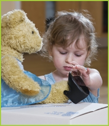 Melody Bear gets help putting on her tap shoes