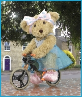 Melody Bear is on her bicycle