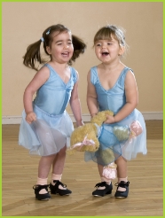 Photo of two girls tap dancing with Melody Bear in her Tip Tap Toe syllabus