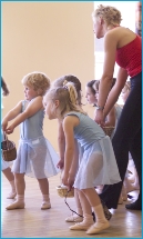 Photo of children walking with heavy baskets