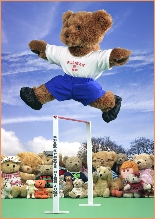 Photo of Milligan Bear jumping over a high jump