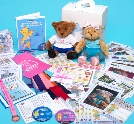 Melody Bear sits with the box that contains her teaching syllabus