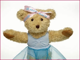 Photo of dancing Melody Bear with her arms out stretched