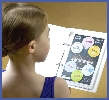 Junior Ballet dancer looks at her vocabulary stickers